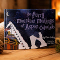 Hardcover edition of The Furry Mountain Monkeys of Aspen, Colorado standing on a wooden table.